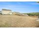 A large backyard with a wood fence at 1640 Andalusian Way, Conyers, GA 30012