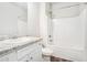 Bathroom featuring vanity with granite countertop, toilet and shower-tub combination at 1640 Andalusian Way, Conyers, GA 30012