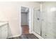 Bathroom with shower, and view into the bedroom at 1640 Andalusian Way, Conyers, GA 30012