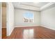 Spacious bedroom with hardwood flooring, a large window, and a walk-in closet for ample storage at 1640 Andalusian Way, Conyers, GA 30012