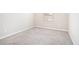 Bedroom featuring neutral carpet, walls, base trim and electrical outlets at 1640 Andalusian Way, Conyers, GA 30012