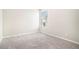 Bedroom features neutral carpet, walls, and a large window for lots of natural light at 1640 Andalusian Way, Conyers, GA 30012