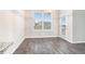 Bright dining area with hardwood floors and view to the backyard at 1640 Andalusian Way, Conyers, GA 30012