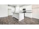 Modern kitchen with stainless steel appliances, granite countertops, and center island at 1640 Andalusian Way, Conyers, GA 30012