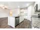 Bright kitchen with granite countertops, stainless steel appliances, and island with a sink at 1640 Andalusian Way, Conyers, GA 30012
