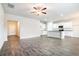 Bright and open living room featuring hardwood floors and access to the kitchen area at 1640 Andalusian Way, Conyers, GA 30012