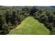 A verdant expanse graces the property, perfect for outdoor activities or enjoying the natural surroundings at 2100 West Wesley Rd, Atlanta, GA 30327