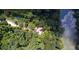 Green canopy of trees with roads winding around the property, and an unseen home at 2100 West Wesley Rd, Atlanta, GA 30327