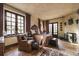 Cozy bedroom with a stone fireplace, large windows, and comfortable seating area at 2100 West Wesley Rd, Atlanta, GA 30327