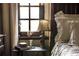 Detailed view of bedroom decor and a table lamp at 2100 West Wesley Rd, Atlanta, GA 30327