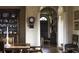 Elegant dining room with hardwood floors, and vintage furniture with detailed wood trim at 2100 West Wesley Rd, Atlanta, GA 30327
