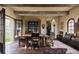 Elegant dining room featuring a rustic table, exposed wood beams, and antique decor at 2100 West Wesley Rd, Atlanta, GA 30327