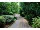 Tree-lined driveway leading to a secluded home at 2100 West Wesley Rd, Atlanta, GA 30327