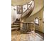Elegant spiral staircase with decorative wood railing and unique tiled flooring at 2100 West Wesley Rd, Atlanta, GA 30327