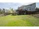 Spacious backyard with large lawn and wooden deck that's perfect for outdoor entertaining at 3174 Country Club Nw Ct, Kennesaw, GA 30144