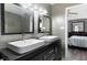 Bathroom features double sink vanity and modern fixtures that leads into a spacious bedroom at 3174 Country Club Nw Ct, Kennesaw, GA 30144
