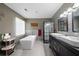 Beautiful bathroom featuring a freestanding tub, glass-enclosed shower, and dual sink vanity at 3174 Country Club Nw Ct, Kennesaw, GA 30144