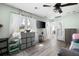Inviting bedroom with a large window, ceiling fan and ample storage with decor at 3174 Country Club Nw Ct, Kennesaw, GA 30144