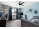 Serene bedroom featuring modern decor, a large window, and a comfortable bed at 3174 Country Club Nw Ct, Kennesaw, GA 30144