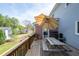 Inviting outdoor deck area with patio umbrella and picnic table; perfect for backyard entertaining at 3174 Country Club Nw Ct, Kennesaw, GA 30144