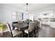 Elegant dining room with modern chandelier, wall art and seating for six at 3174 Country Club Nw Ct, Kennesaw, GA 30144