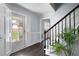 Welcoming entryway with hardwood floors, staircase, and a view to the front yard at 3174 Country Club Nw Ct, Kennesaw, GA 30144