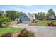 Charming two-story home featuring a two-car garage, and beautifully landscaped front yard at 3174 Country Club Nw Ct, Kennesaw, GA 30144
