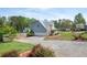 Charming two-story home with a large driveway, and well-maintained landscaping at 3174 Country Club Nw Ct, Kennesaw, GA 30144
