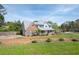 Spacious home with a large yard, covered porch, and a charming mix of brick and siding at 3174 Country Club Nw Ct, Kennesaw, GA 30144