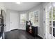 Bright kitchen nook with stainless fridge, beverage center, and access to patio at 3174 Country Club Nw Ct, Kennesaw, GA 30144