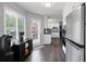 Bright kitchen nook with stainless fridge, beverage center, and access to patio at 3174 Country Club Nw Ct, Kennesaw, GA 30144
