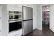 Gourmet kitchen has stainless steel appliances and leads to a walk-in pantry at 3174 Country Club Nw Ct, Kennesaw, GA 30144