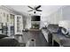 Spacious living room has fireplace, ceiling fan and French doors leading to an outdoor patio at 3174 Country Club Nw Ct, Kennesaw, GA 30144