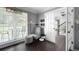 Cozy sitting room with a comfortable armchair, a window with natural light, and hardwood floors at 3174 Country Club Nw Ct, Kennesaw, GA 30144