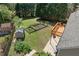 Aerial view of backyard with garden area, shed, and deck, offering space for outdoor enjoyment at 3503 Dunbar Ln, Suwanee, GA 30024