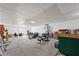 Spacious basement featuring workout equipment and ample room for activities at 3503 Dunbar Ln, Suwanee, GA 30024