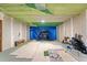 Finished basement area with a golf simulator, carpeting, and painted walls at 3503 Dunbar Ln, Suwanee, GA 30024