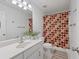 Clean bathroom featuring a vanity with modern hardware and a shower with a polka dot curtain at 3503 Dunbar Ln, Suwanee, GA 30024