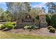 Stone entrance sign for Canterbury Place neighborhood with manicured landscaping in the front at 3503 Dunbar Ln, Suwanee, GA 30024