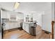 Open kitchen with stainless appliances, large island, and adjacent dining area at 3503 Dunbar Ln, Suwanee, GA 30024