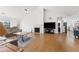 Bright living room featuring a fireplace, ceiling fan, and hardwood flooring throughout at 3503 Dunbar Ln, Suwanee, GA 30024