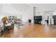 Spacious living room with a fireplace, large windows, high ceilings, and hardwood floors at 3503 Dunbar Ln, Suwanee, GA 30024