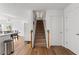 Staircase connecting the main floor, with wood flooring throughout the home at 3503 Dunbar Ln, Suwanee, GA 30024