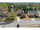Aerial view of home showcasing front yard, driveway, and neighborhood surroundings at 3503 Dunbar Ln, Suwanee, GA 30024