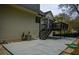 A backyard view showcases a concrete patio, a dark wood deck and stairs, and a grassy area at 2048 Kelvin Dr, Lawrenceville, GA 30043