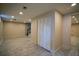Tile basement with recesed lighting, stairs and closet for ample storage at 2048 Kelvin Dr, Lawrenceville, GA 30043