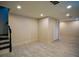 Finished basement area with tile flooring, stairs and closet at 2048 Kelvin Dr, Lawrenceville, GA 30043