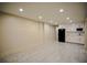 Finished basement features tile flooring and a kitchenette with modern appliances at 2048 Kelvin Dr, Lawrenceville, GA 30043