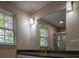 Bathroom featuring a mirror, granite vanity and a window at 2048 Kelvin Dr, Lawrenceville, GA 30043