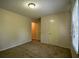Bedroom with neutral walls, a carpeted floor, a window and closet for storage at 2048 Kelvin Dr, Lawrenceville, GA 30043